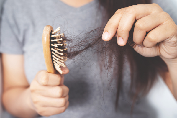 15 Tips to Prevent and Manage Female Balding | Female hair loss is more common than you think - some studies suggest two thirds of women in menopause experience thinning hair and bead spots. If you have thin hair, this post is a great resource. It includes common causes of hair loss in women, easy remedies you can try as you figure out how to fix the root cause, and tips on how to cover and how to hide balding, including the best hairstyles to try and which ones to avoid.