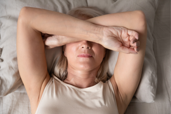 How to Beat Menopause Insomnia: 7 Tips for Better Sleep | Menopause - and perimenopause - bring a whole slew of undesirable symptoms, from night sweats, to mood swings, to weight gain, to sleep disturbances. If you're a woman in your 40s or 50s and you struggle to fall asleep, stay asleep, and/or get enough deep REM sleep, this post is for you! We're sharing our best natural insomnia tips to help you develop healthy sleep hygiene, enjoy restoration sleep, and wake up refreshed and energized!